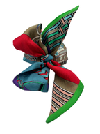 Colorful patterned fabric bow on a white background